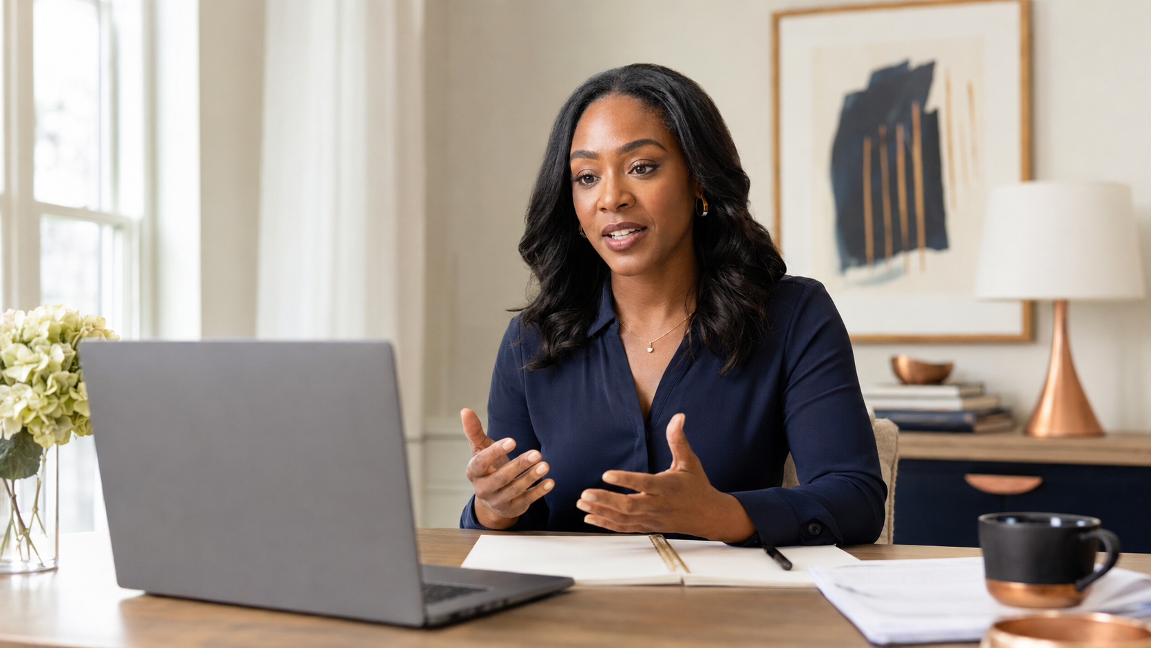 A professional Black woman practicing for a remote interview